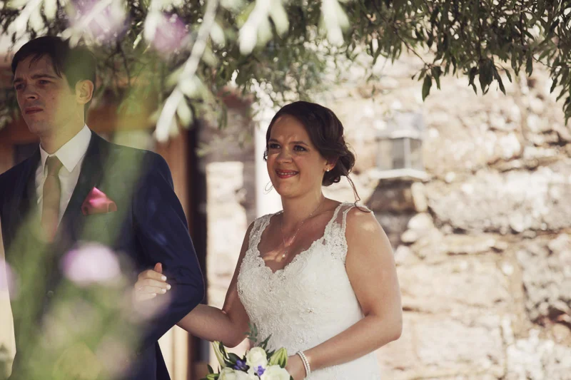 Beautiful bride walking to her husband to be at Blencowe Hall, The Rowley Estates, Lake District wedding