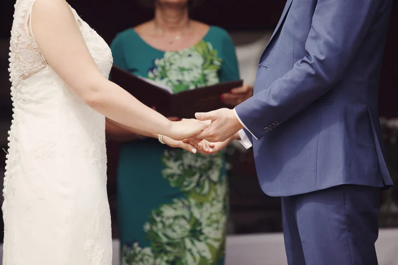 Bride and groom holding hands at Blencowe Hall, The Rowley Estates, Lake District wedding