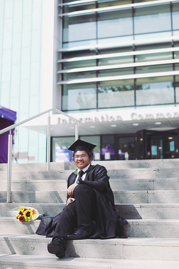 Outdoor graduation portrait at University of Sheffield campus