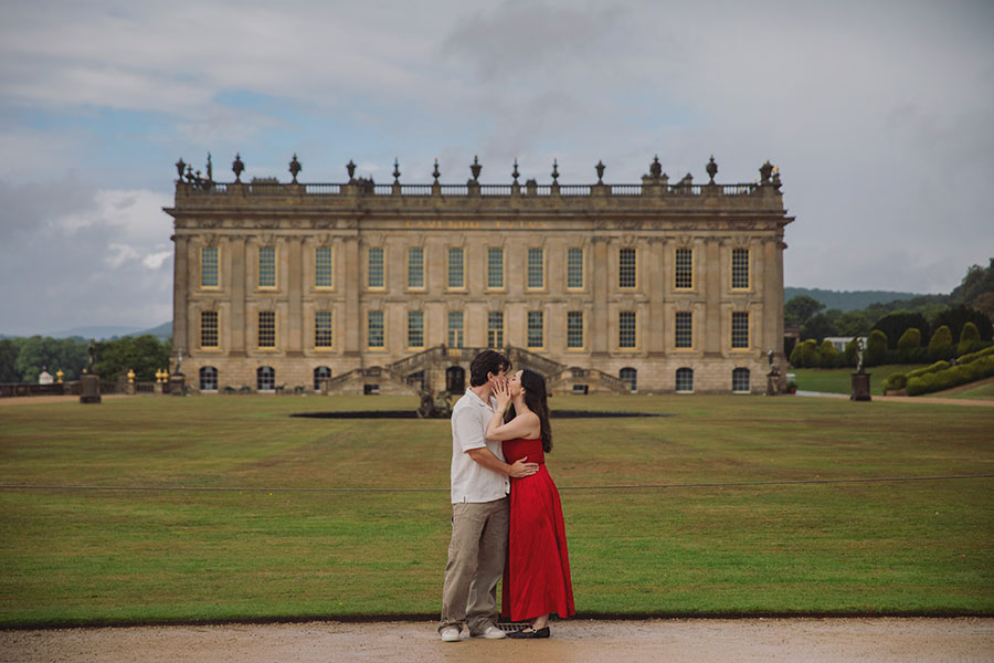 Couple enjoying a surprise engagement in the landscaped gardens at Chatsworth House.