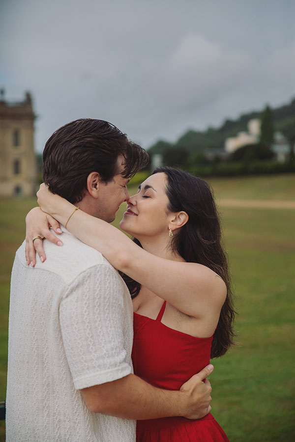 Couple enjoying a surprise engagement in the landscaped gardens at Chatsworth House.