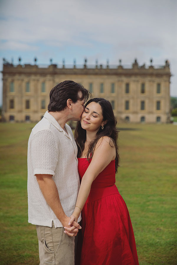 Couple enjoying a surprise engagement in the landscaped gardens at Chatsworth House.