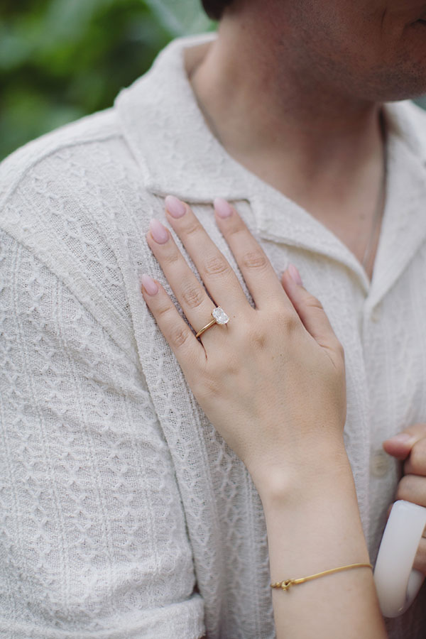 Couple celebrating their engagement during a romantic proposal at Chatsworth House.