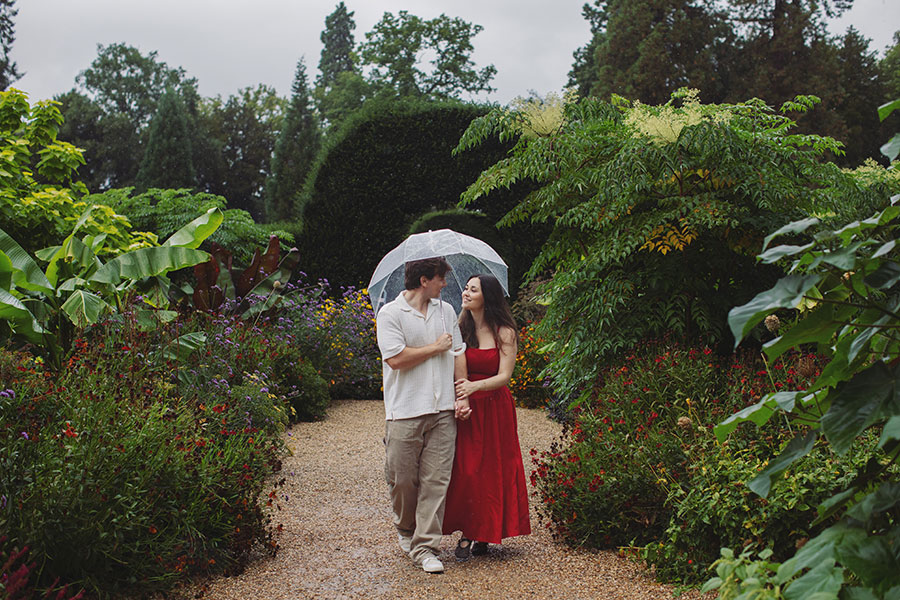 Couple celebrating their engagement during a romantic proposal at Chatsworth House.