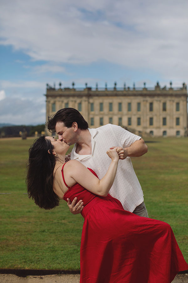Couple enjoying a surprise engagement in the landscaped gardens at Chatsworth House.