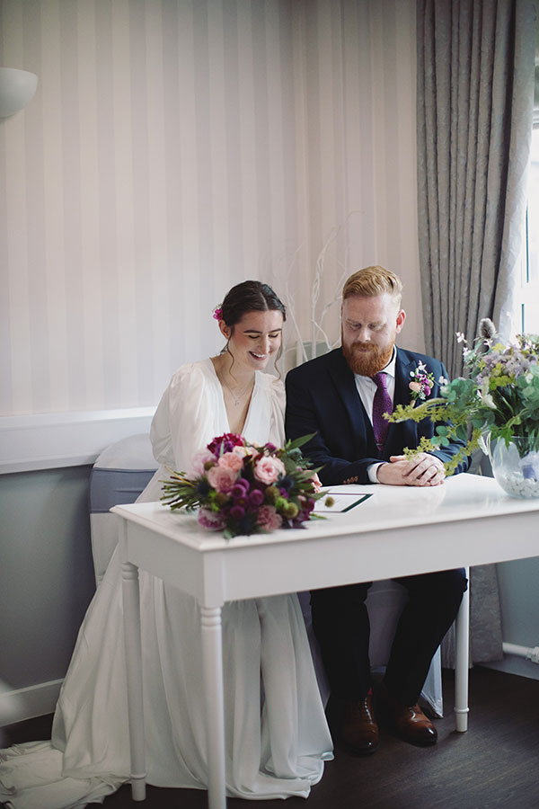 Bride and groom exchanging vows during an intimate elopement at Stamford Registry Office