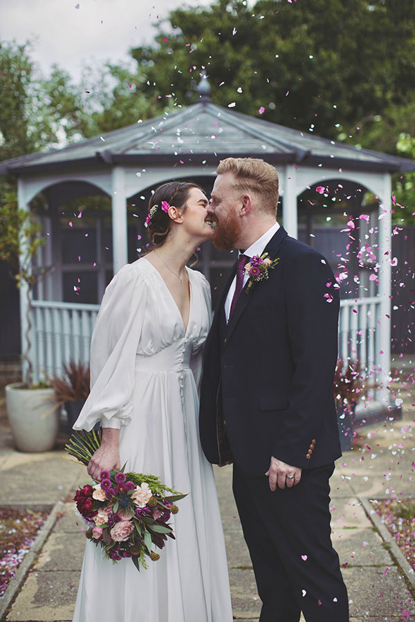 Couple celebrating their intimate Stamford Registry Office wedding with candid photography