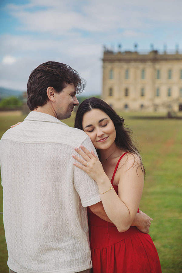 Couple enjoying a surprise engagement in the landscaped gardens at Chatsworth House.