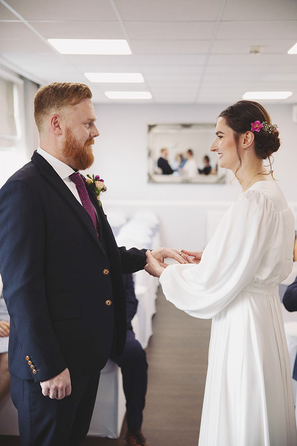 Bride and groom exchanging vows during an intimate elopement at Stamford Registry Office