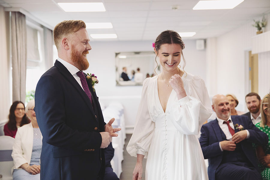 Bride and groom exchanging vows during an intimate elopement at Stamford Registry Office