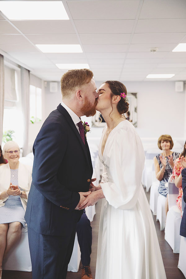 Bride and groom exchanging vows during an intimate elopement at Stamford Registry Office