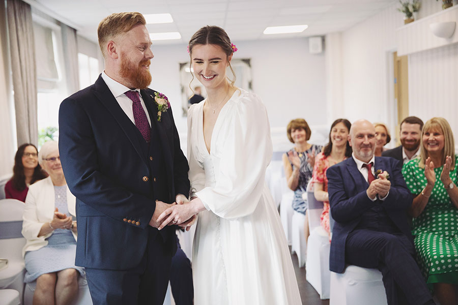 Bride and groom exchanging vows during an intimate elopement at Stamford Registry Office