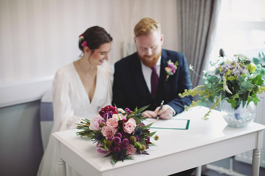 Bride and groom exchanging vows during an intimate elopement at Stamford Registry Office