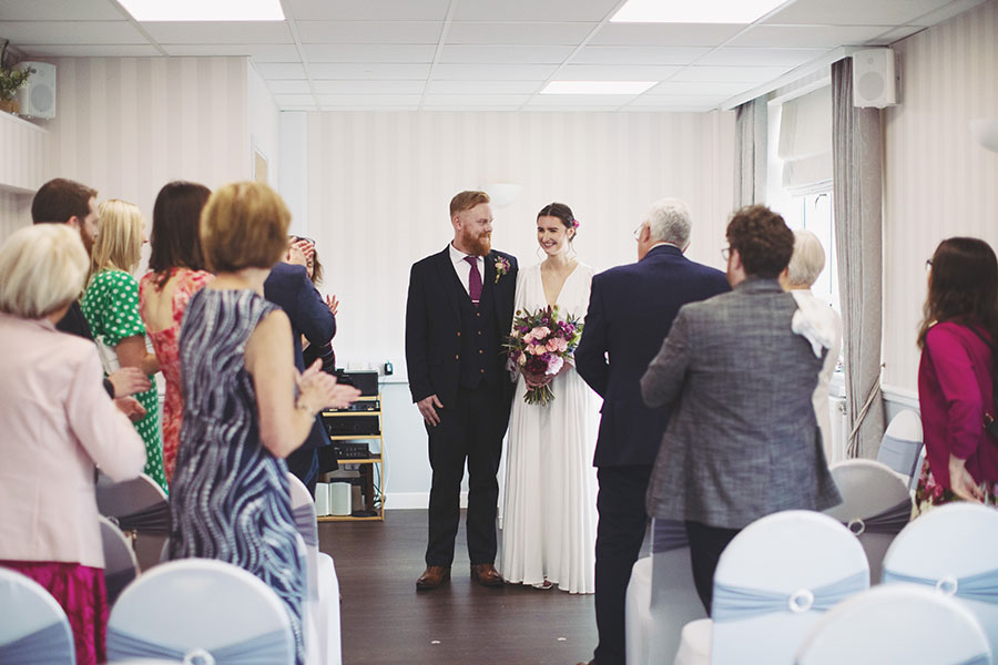 Bride and groom exchanging vows during an intimate elopement at Stamford Registry Office