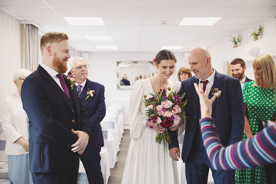 Candid wedding photography at Stamford Registry Office capturing a romantic elopement