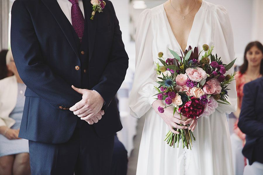 Bride and groom exchanging vows during an intimate elopement at Stamford Registry Office