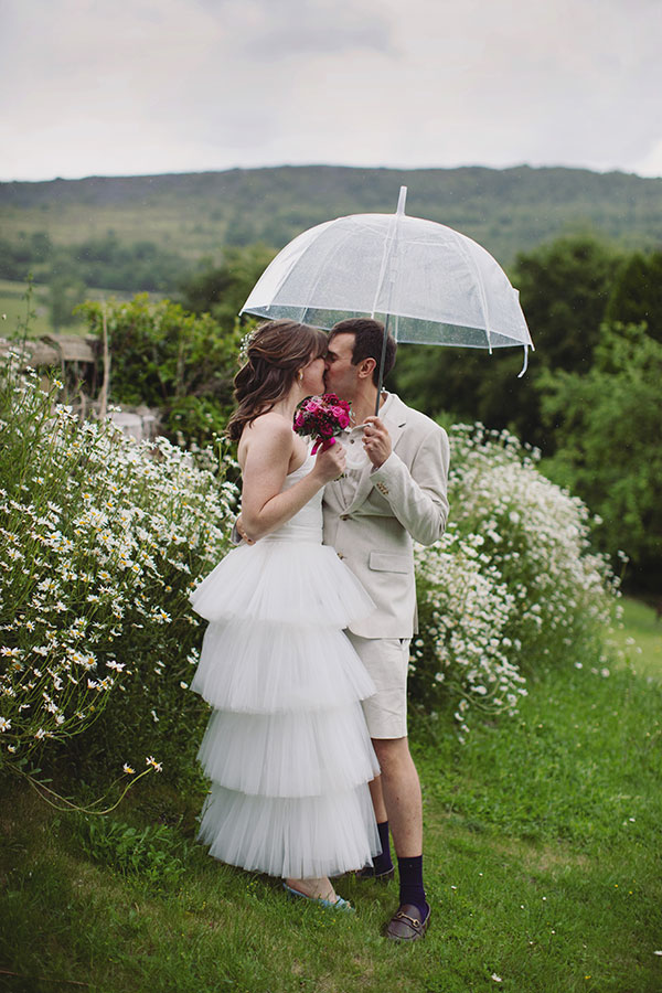 Bride and groom walking through the grounds during their Cliff College wedding photography session in Hope Valley.