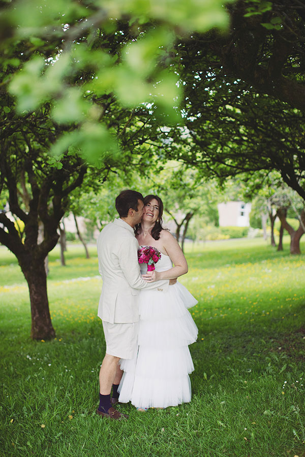 Bride and groom walking through the grounds during their Cliff College wedding photography session in Hope Valley.