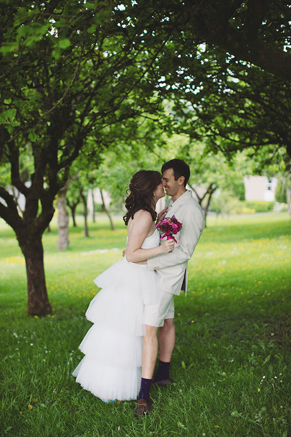 Bride and groom walking through the grounds during their Cliff College wedding photography session in Hope Valley.