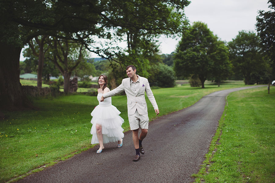 Outdoor portrait of Chris and Gill with the Peak District hills behind them – Cliff College wedding photography.