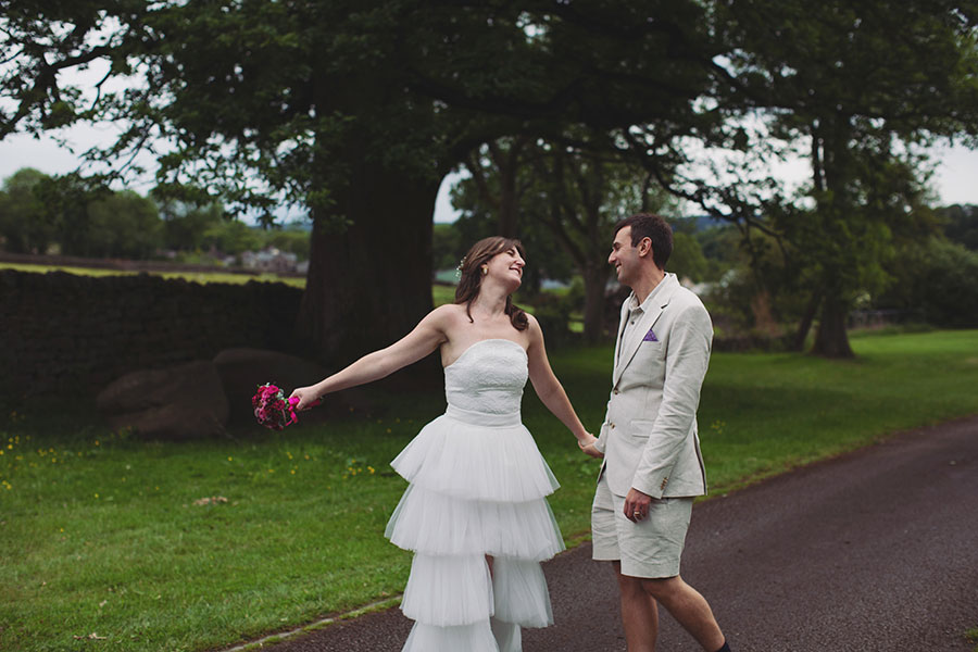 Outdoor portrait of Chris and Gill with the Peak District hills behind them – Cliff College wedding photography.