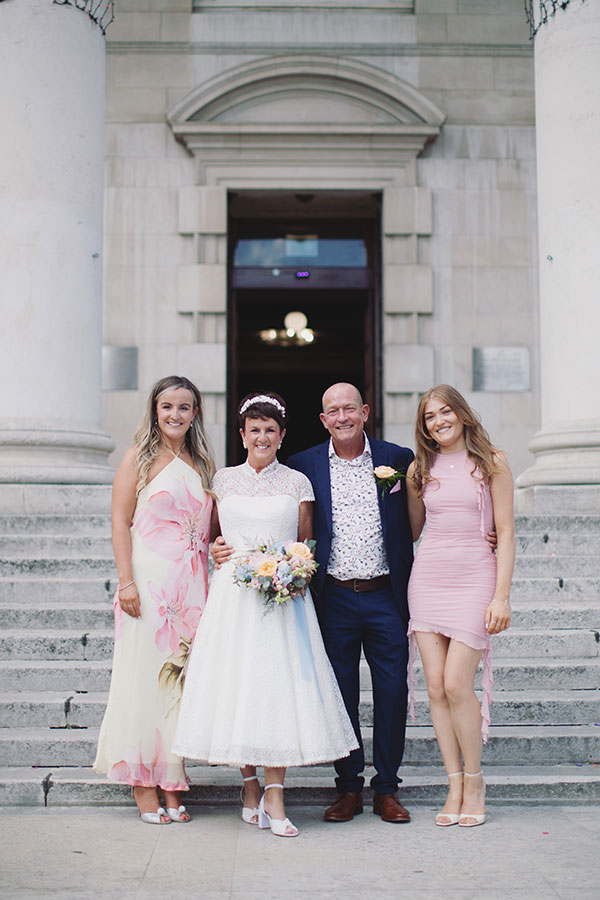 Lisa & Dean ♡ Leeds Civic Hall Wedding 24 Couple celebrating outside Leeds Civic Hall after their wedding ceremony