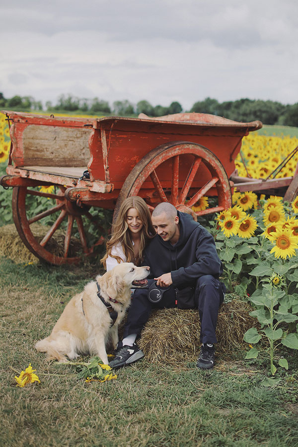 Natural engagement photos of couple in sunflower field at Barlow Sunflower Field