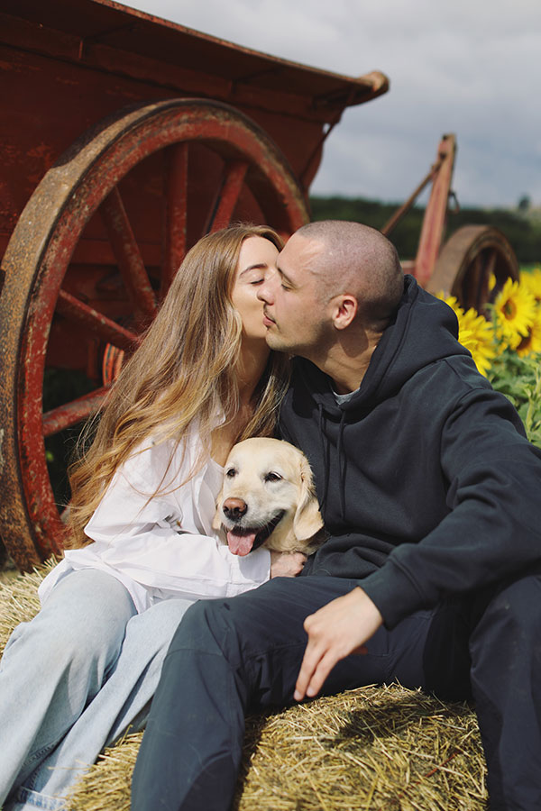 Ellie and Kamen smiling together during their Barlow Sunflower Field engagement photoshoot