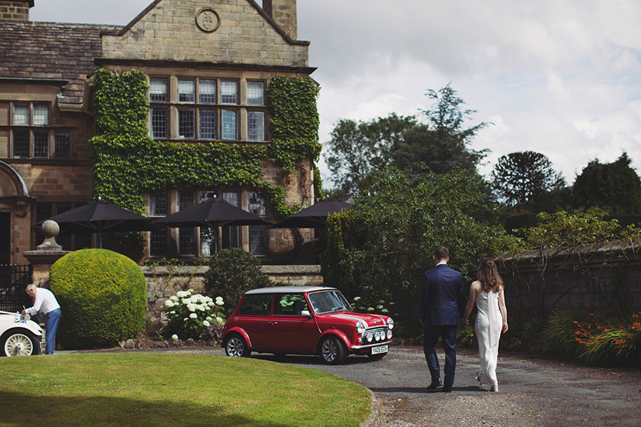 Newlyweds sharing a quiet moment outside Fischer’s Baslow Hall during their elegant Derbyshire wedding.