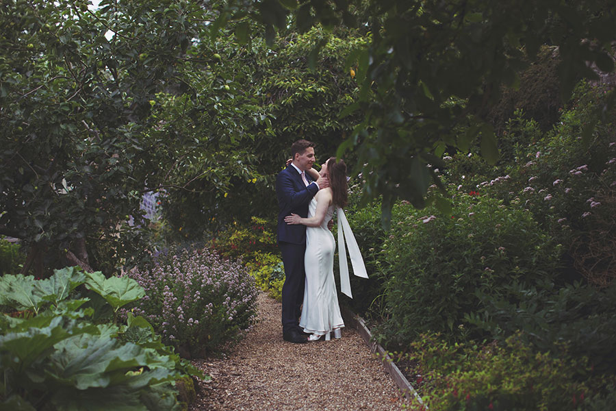 Newlyweds sharing a quiet moment outside Fischer’s Baslow Hall during their elegant Derbyshire wedding.