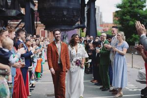 Sam & Chandy ♡ Kelham Island Museum Wedding 3 Bride & Groom walking hand in hand at their Kelham Island Museum wedding in Sheffield
