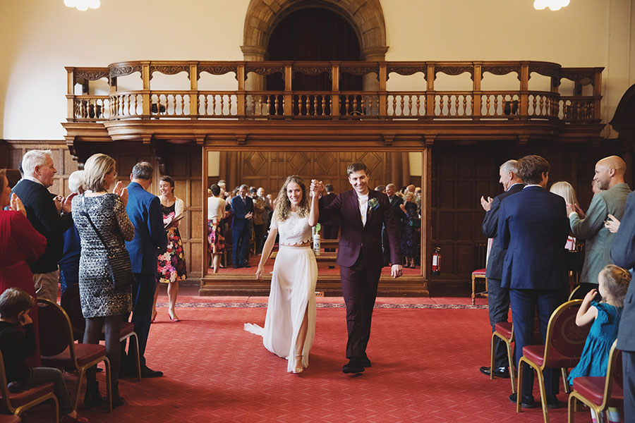 Candid moments from a Sheffield Town Hall wedding with guests celebrating outside