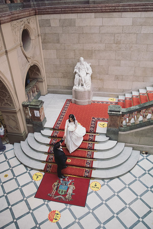 Relaxed wedding portraits of a couple inside Sheffield Town Hall in Sheffield city centre