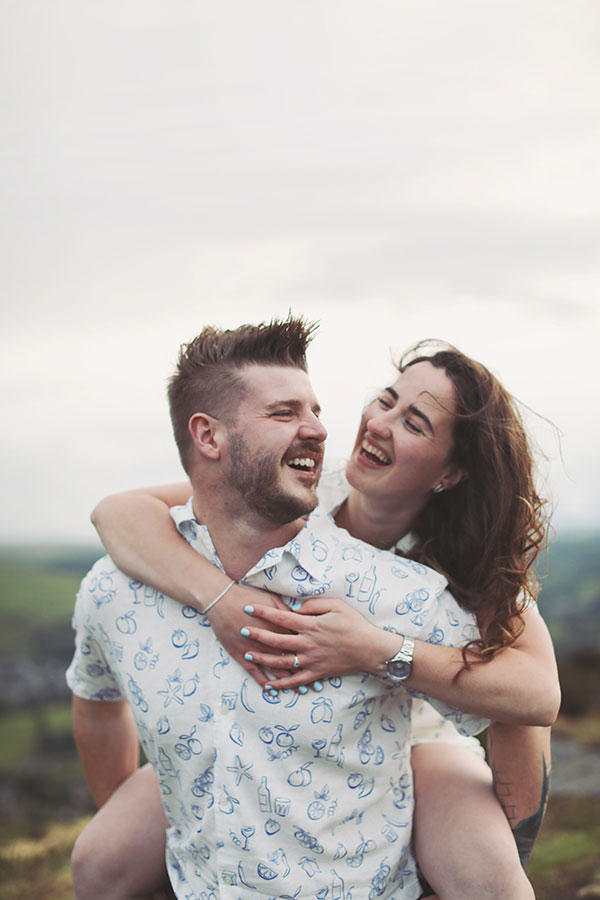 Diana & Alex ♡ Peak District Engagement Photoshoot 18 Relaxed engagement portrait of Diana and Alex outdoors in the Peak District landscape.