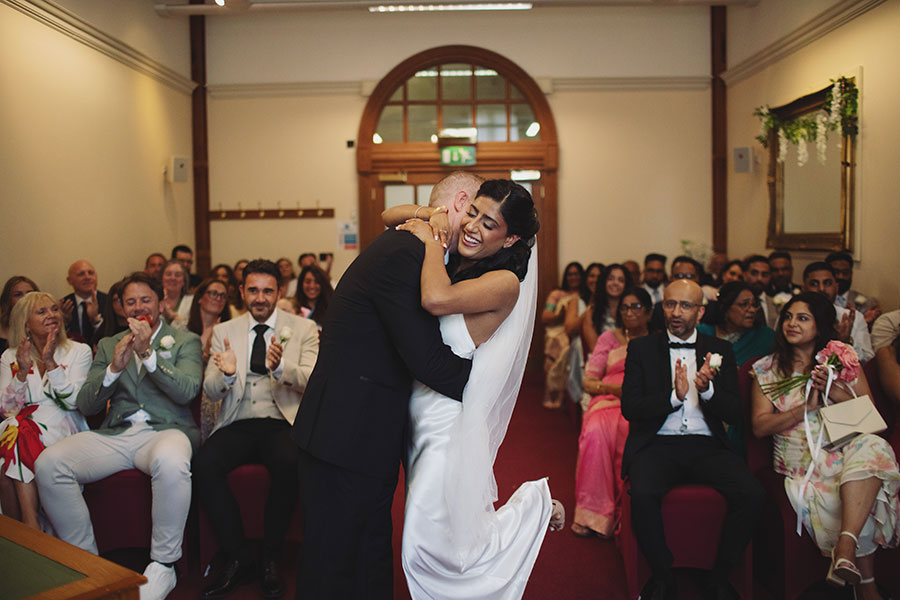 Rich and Shaily exchanging vows during their Sheffield Town Hall wedding ceremony