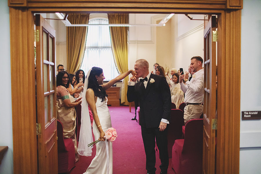 Rich and Shaily exchanging vows during their Sheffield Town Hall wedding ceremony