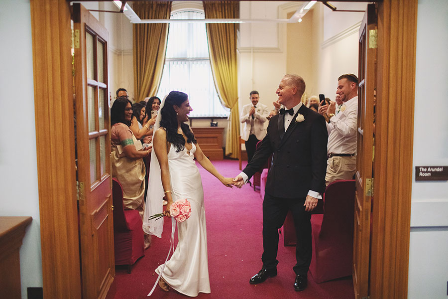 Rich and Shaily exchanging vows during their Sheffield Town Hall wedding ceremony