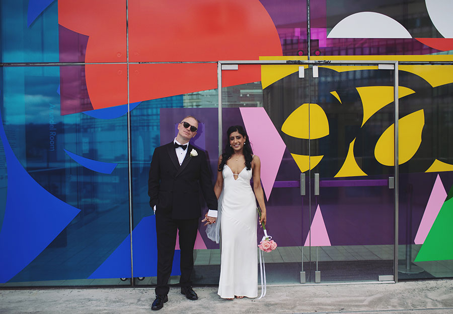 Rich and Shaily laughing together during their Sheffield Town Hall wedding
