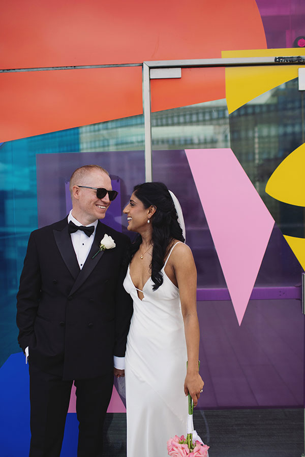 Rich and Shaily laughing together during their Sheffield Town Hall wedding