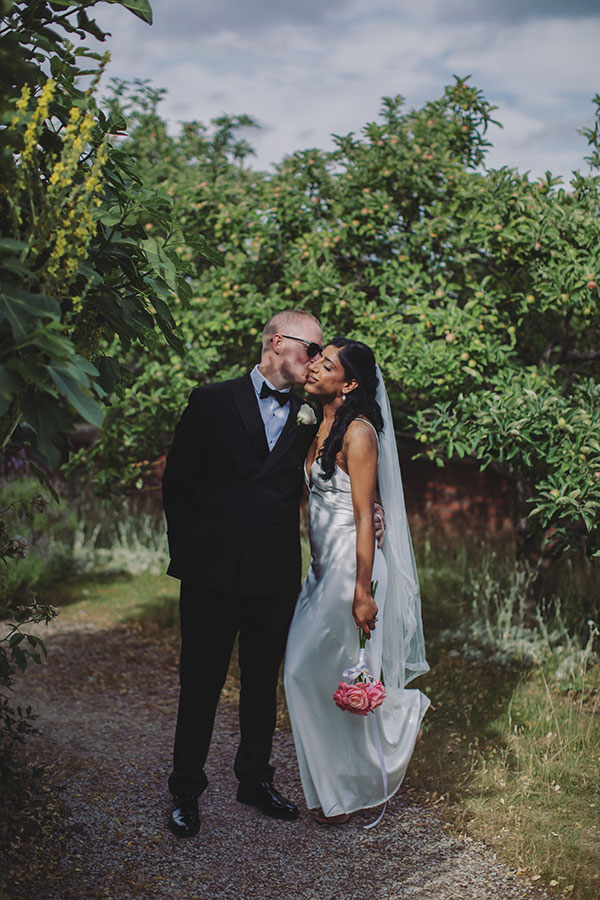 Rich and Shaily laughing together during their Sheffield Town Hall wedding