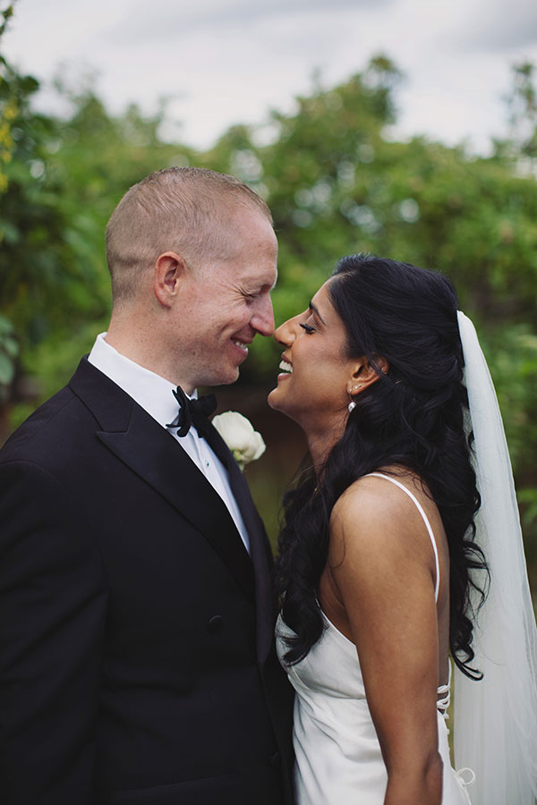 Rich and Shaily laughing together during their Sheffield Town Hall wedding