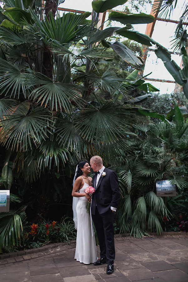 Rich and Shaily laughing together during their Sheffield Town Hall wedding