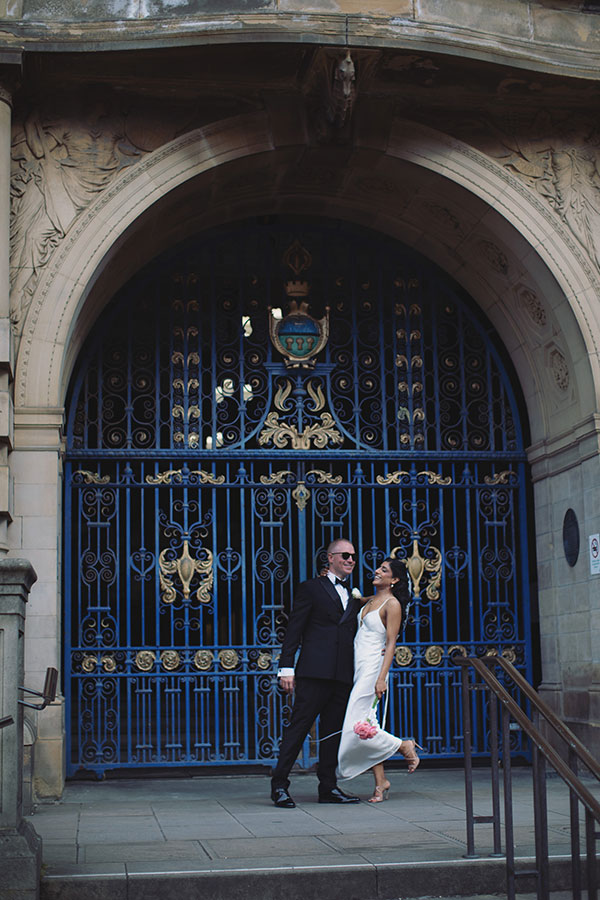 Rich and Shaily laughing together during their Sheffield Town Hall wedding