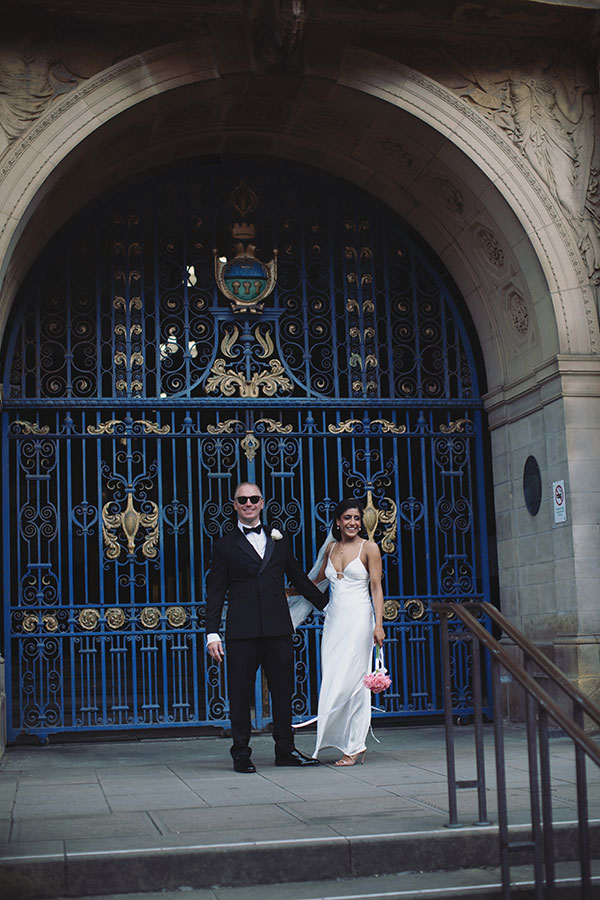 Rich and Shaily laughing together during their Sheffield Town Hall wedding