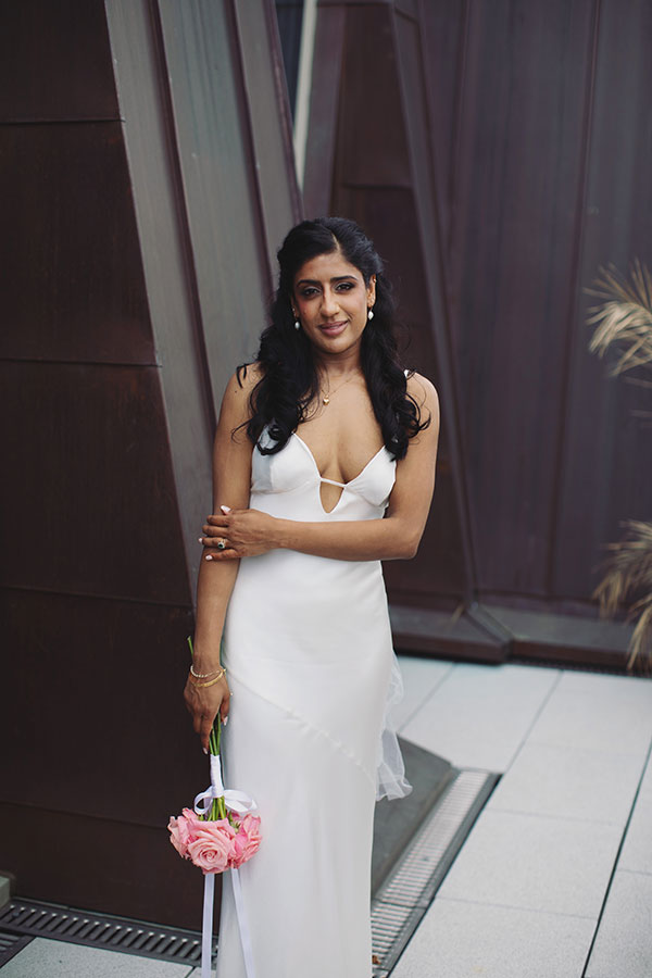 Rich and Shaily laughing together during their Sheffield Town Hall wedding