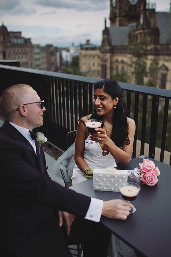 Rich and Shaily laughing together during their Sheffield Town Hall wedding