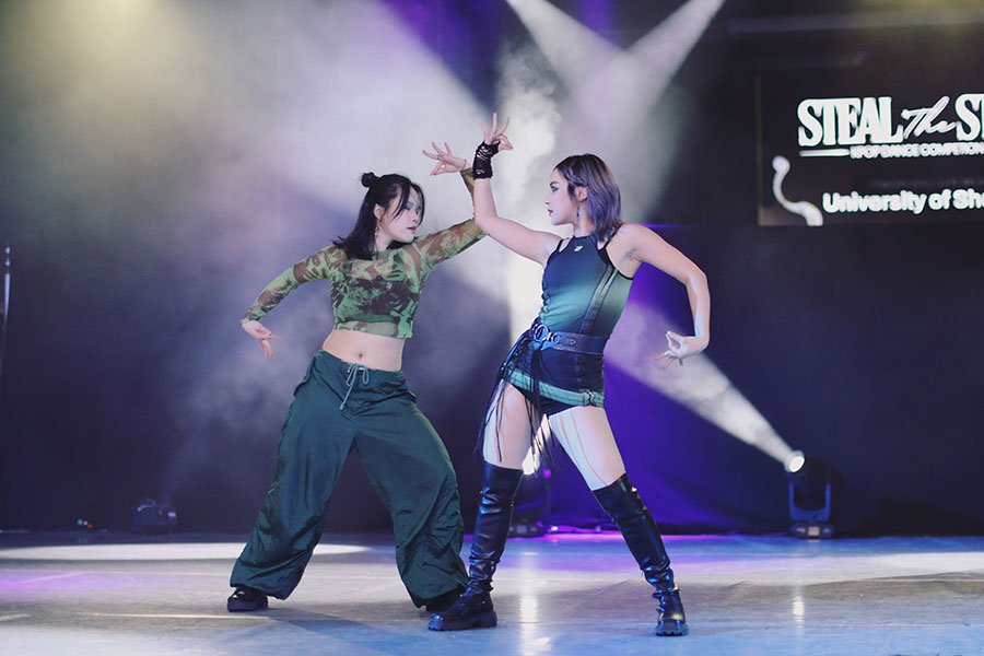 UK Kpop Dance Competition ♡ Steal The Stage 2025 100 Full stage shot of competing university dance crew performing at the University of Sheffield.