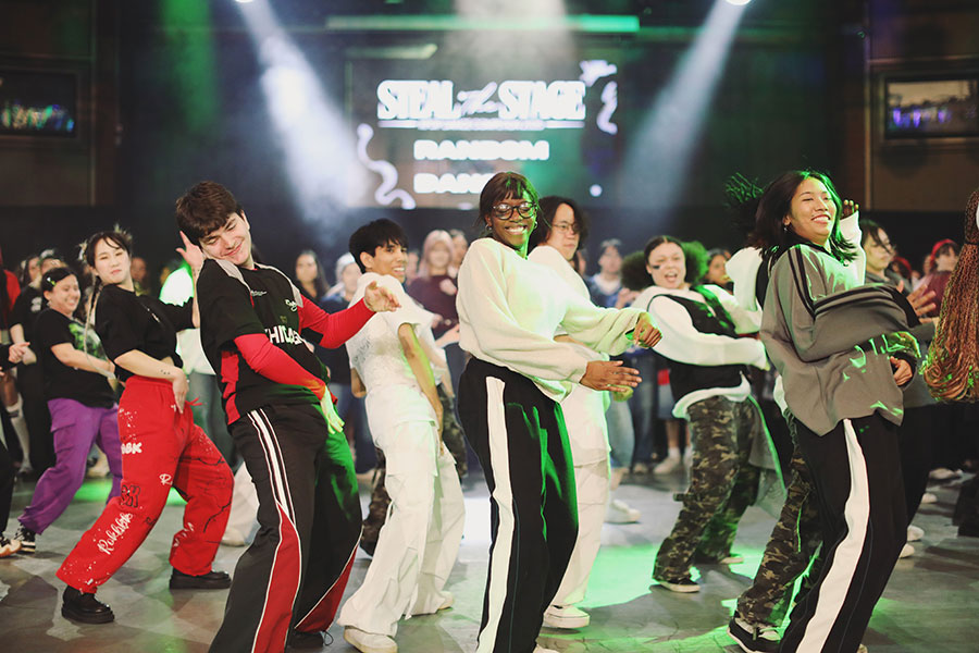 UK Kpop Dance Competition ♡ Steal The Stage 2025 22 Boy group category performers mid-choreography under dramatic purple stage lighting at Steal The Stage 2025.