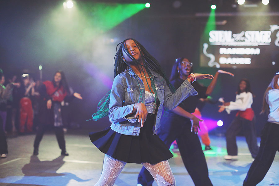 UK Kpop Dance Competition ♡ Steal The Stage 2025 26 Boy group category performers mid-choreography under dramatic purple stage lighting at Steal The Stage 2025.