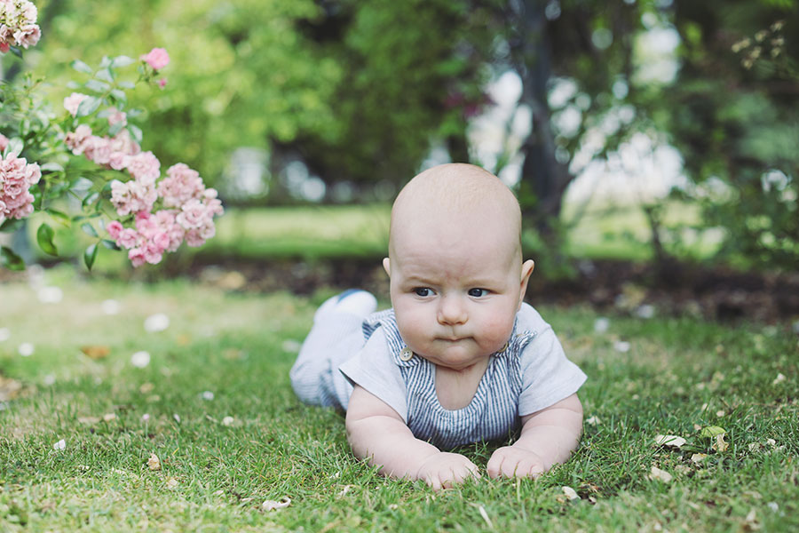 Parents playing with their baby during a summer photoshoot in Sheffield